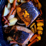 Roasted pork loin & rooster with potatoes and carrots.
