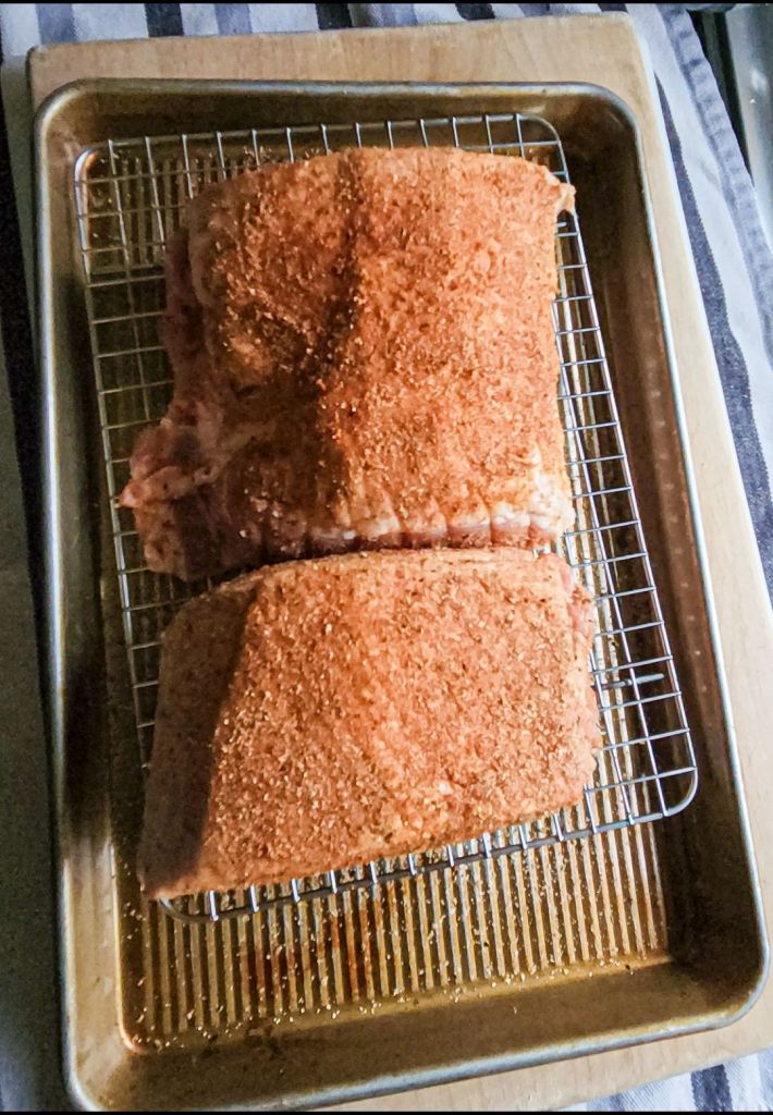 Rob pork loin rubbed with the dry spice rub.