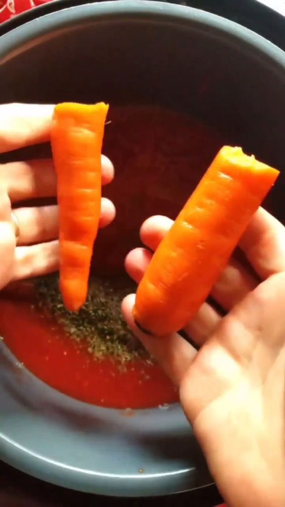 adding in a raw carrot for natural sweetness in the keto marinara sauce.