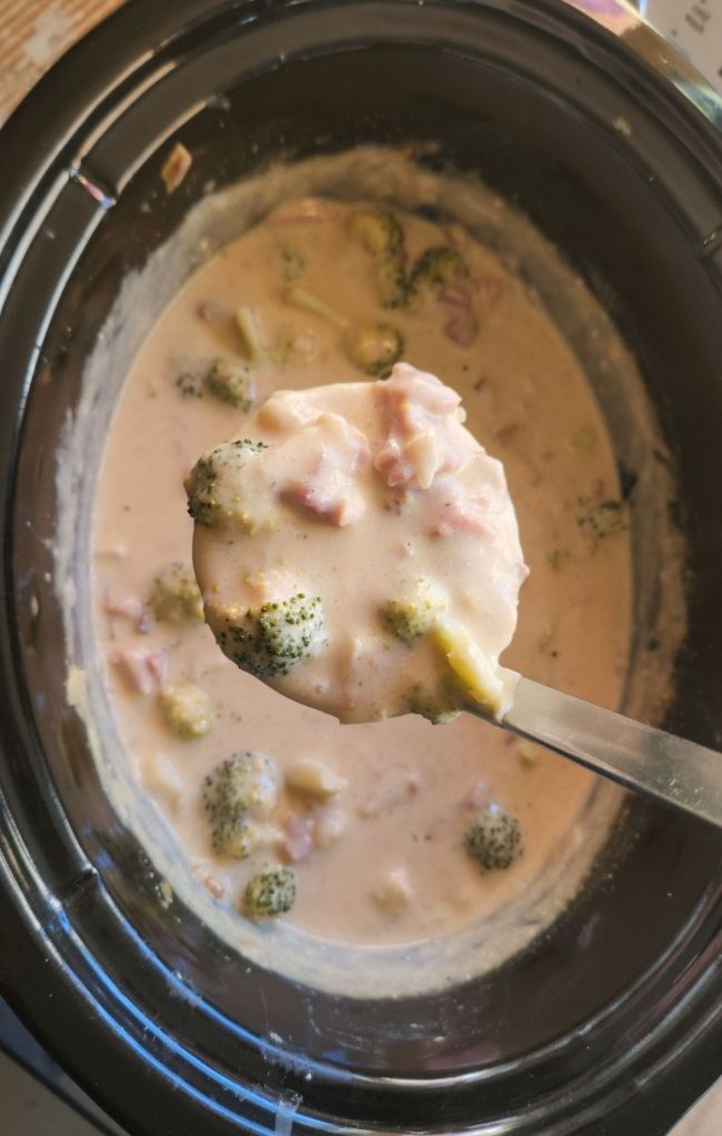Gluten Free Ham and Broccoli Slow Cooker Soup (Keto) being ladeled up.