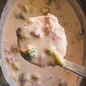 Gluten Free Ham and Broccoli Slow Cooker Soup (Keto) being ladeled up.