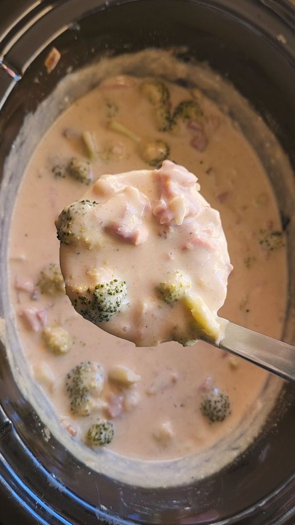 Gluten Free Ham and Broccoli Slow Cooker Soup (Keto) being ladeled up.