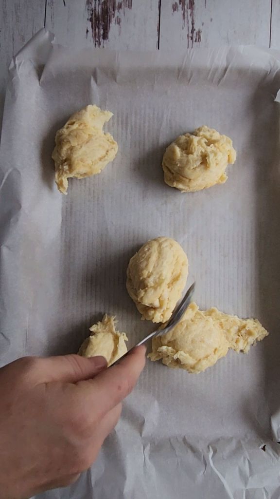 Pressing the crust out for the best gluten-free keto friendly pizza pressed out into a pan.