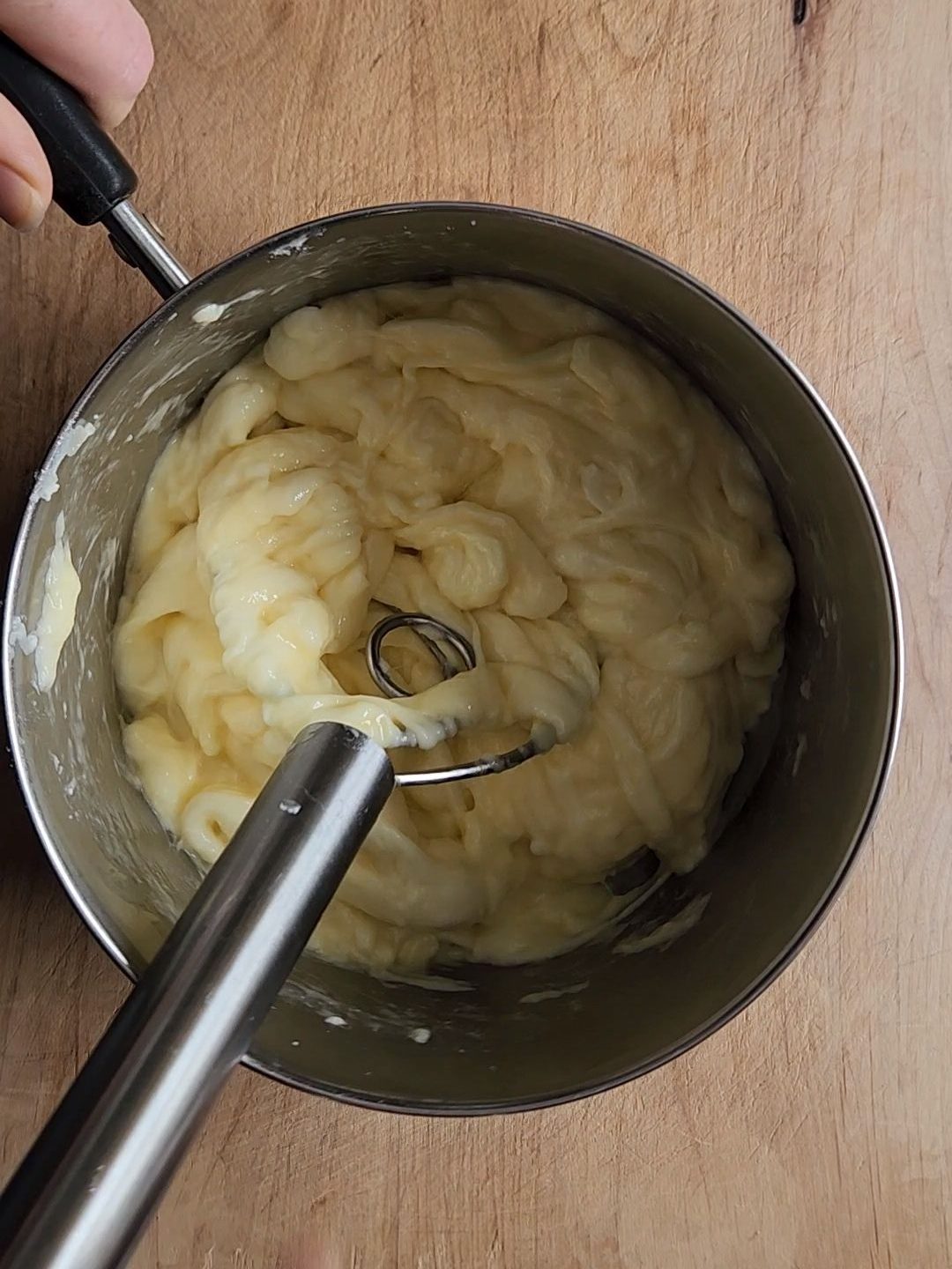 Melted cheeses with egg mixed in.