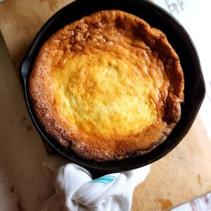 The Best Gluten Free Keto Dutch Baby Pancake Recipe made in a cast iron skillet.