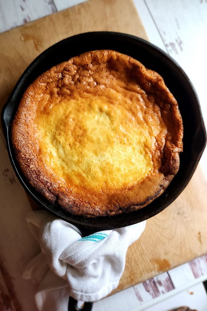 The Best Gluten Free Keto Dutch Baby Pancake Recipe made in a cast iron skillet.