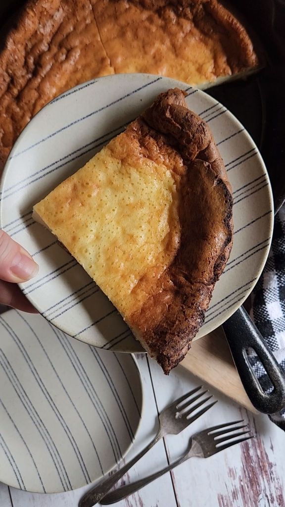 A piece of the best gluten-free keto Dutch baby pancake recipe served up on a plate.