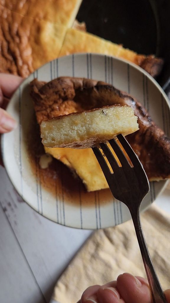 Eating the best gluten-free keto Dutch baby pancake recipe with a piece on the fork.