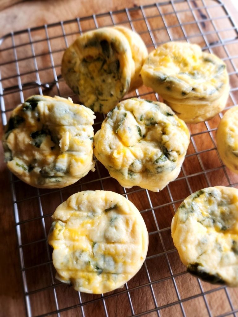 Prepared egg bites on a plate and wire rack