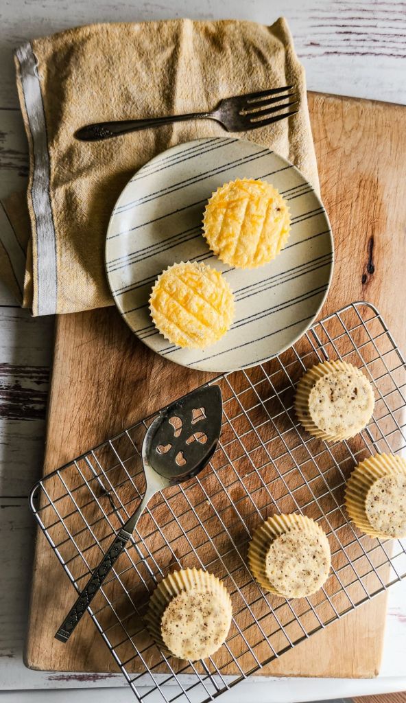 Prepared egg bites on a plate and wire rack.