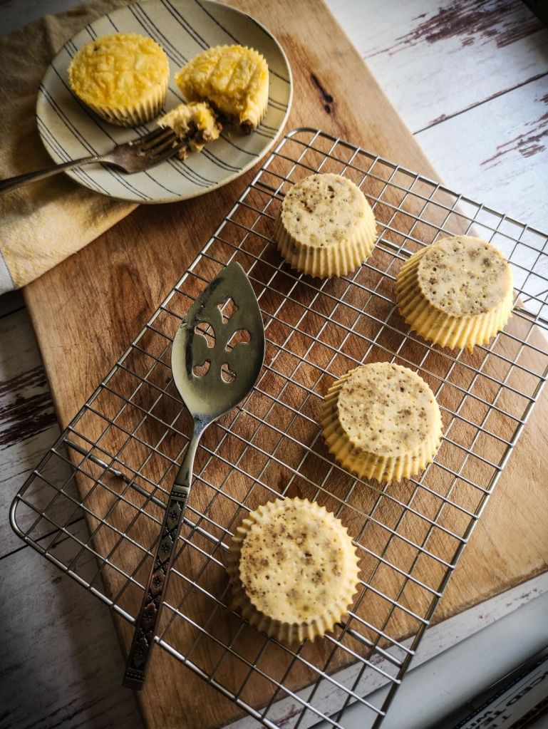 Prepared egg bites on a plate and wire rack.