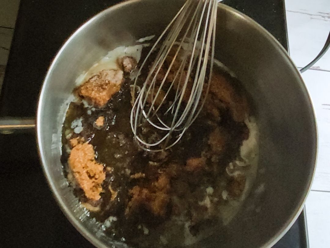 stirring up ingredients for Easy Homemade Low Carb Butterscotch Syrup Recipe.