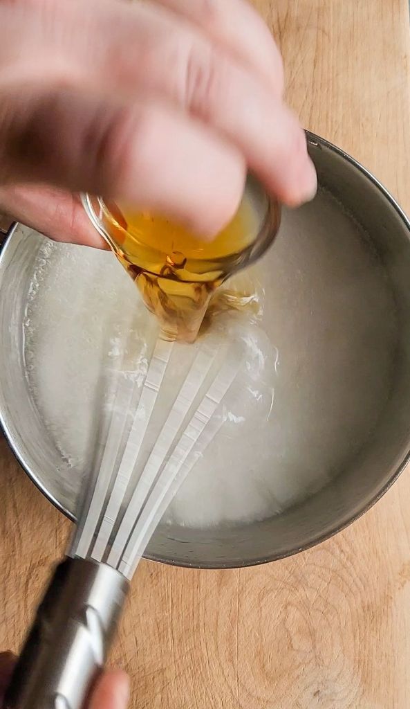 Adding vanilla extract to the keto friendly honey substitute recipe.