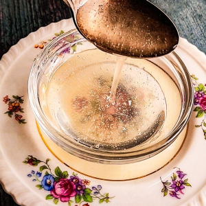 Keto friendly honey substitute being poured from a spoon.