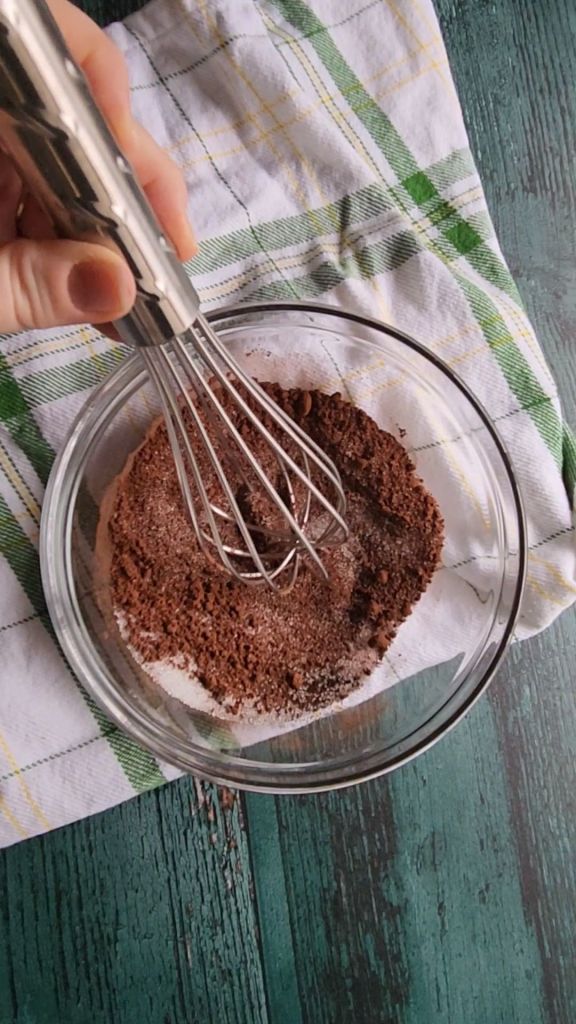 Erythritol and cocoa powder plus espresso powder being whisked up.