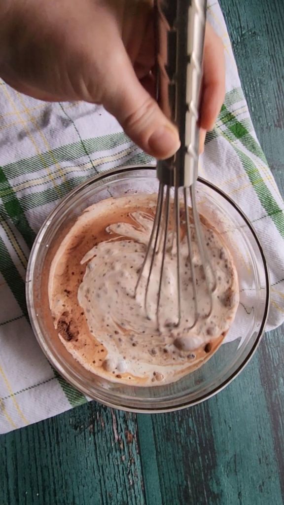 Dry ingredients being whisked up to make the best low carb copycat Baileys Irish Cream recipe.