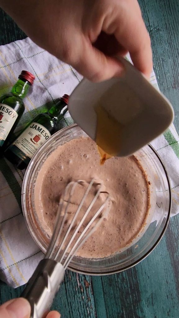 Vanilla extract being added to the best low carb copycat Baileys Irish Cream recipe.