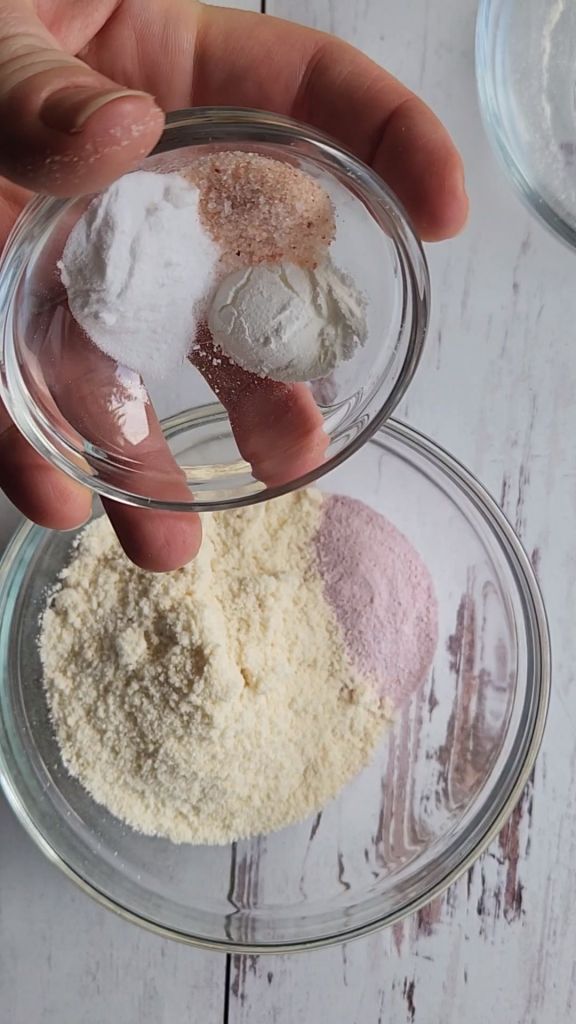 Combining dry ingredients for the best gluten-free strawberry pudding cake recipe.