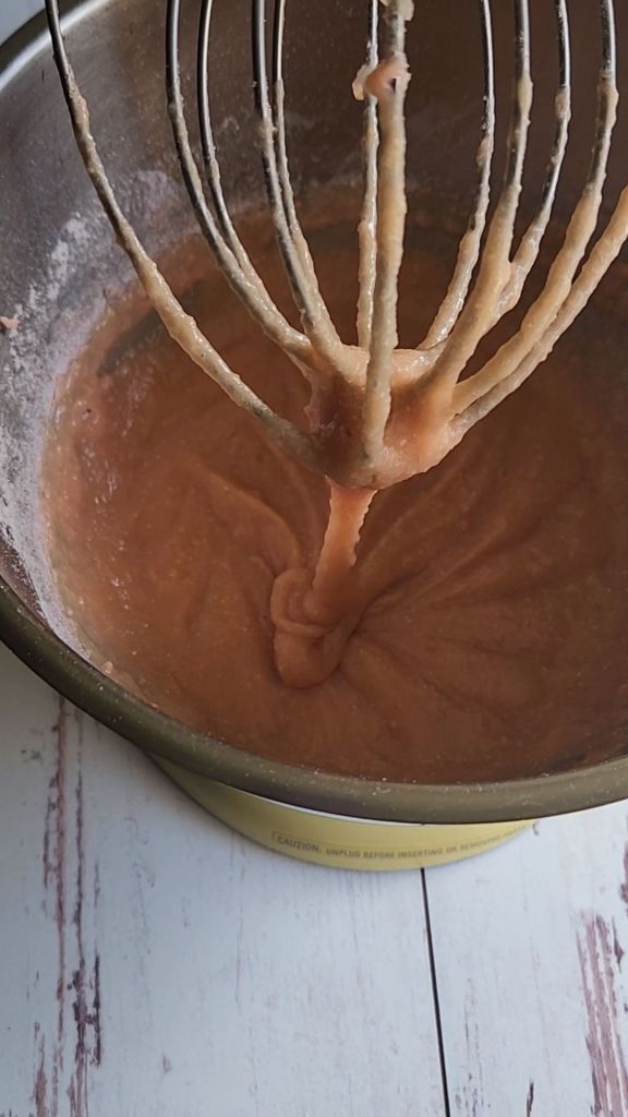 Completed batter in a mixer for the best gluten-free strawberry pudding cake.