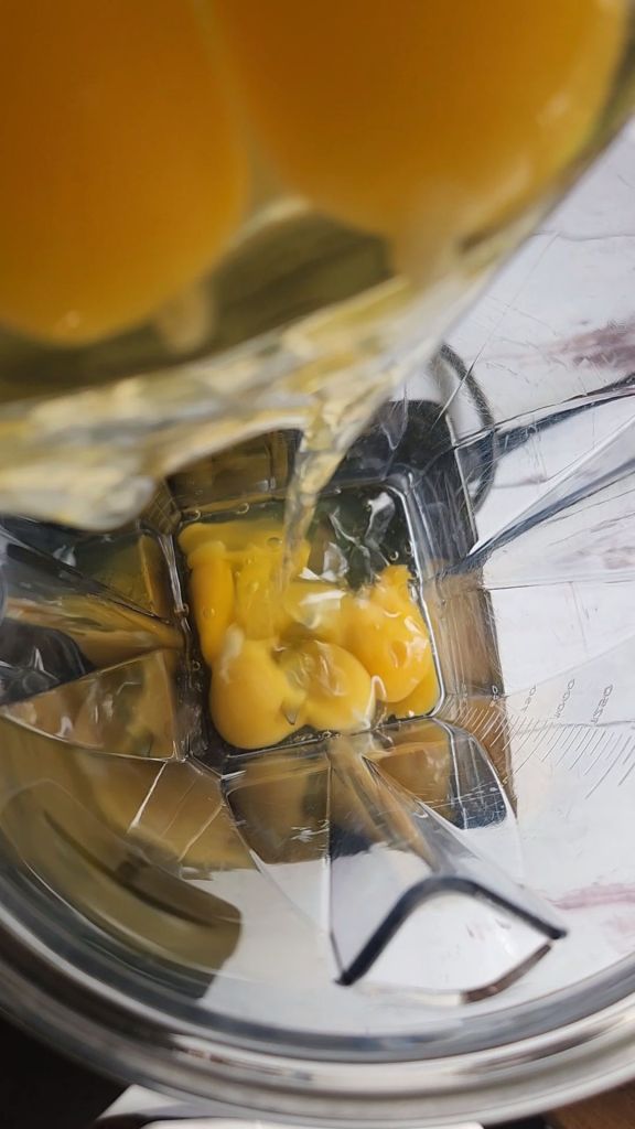 Adding eggs to the blender to make gluten-free keto copycat Starbucks egg bites.