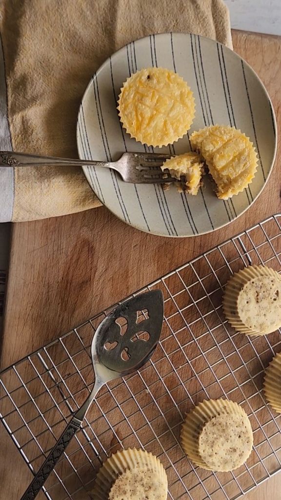 Prepared egg bites on a plate and wire rack.