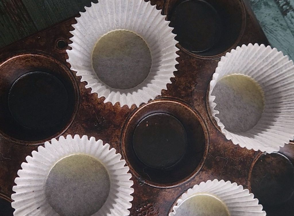 Muffin tins filled with paper cups.