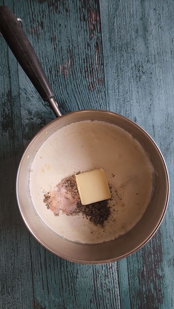 Making cream soup in saucepan for Easy gluten-free chicken Divan casserole recipe.