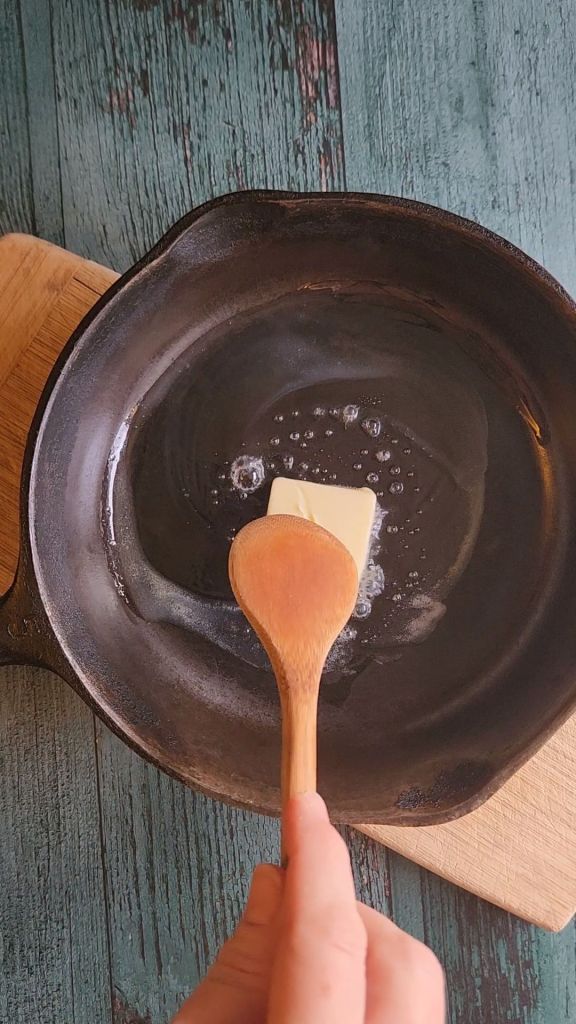 Melting butter in skillet.