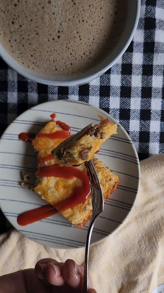 Preheated keto sausage breakfast bar on a plate with ketchup.