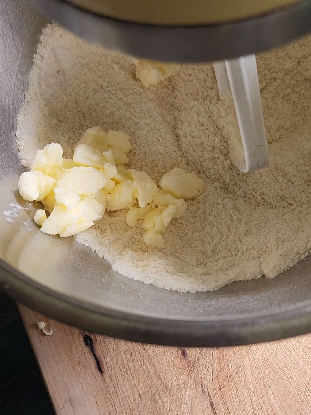 Mixing batter into the dry ingredients of Grandma's gluten-free cinnamon coffee cake recipe.