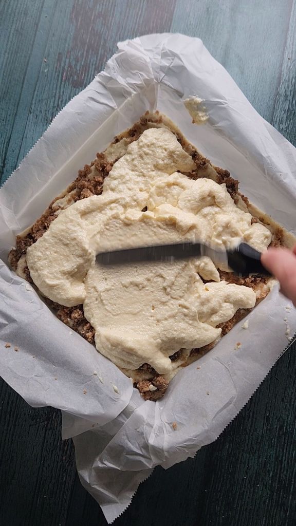 Spreading out third layer of cake batter for Grandma's gluten-free cinnamon coffee cake recipe.