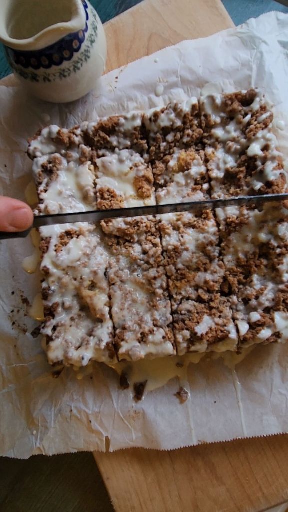 Slicing up baked Grandma's gluten-free cinnamon coffee cake.