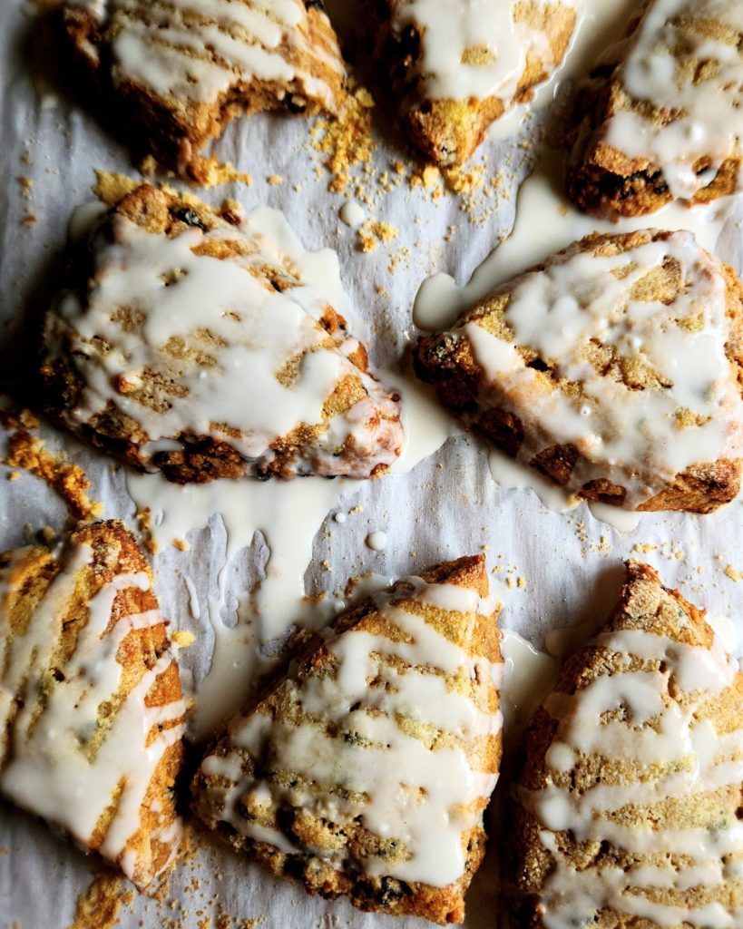 Adding drizzle to gluten-free scones.
