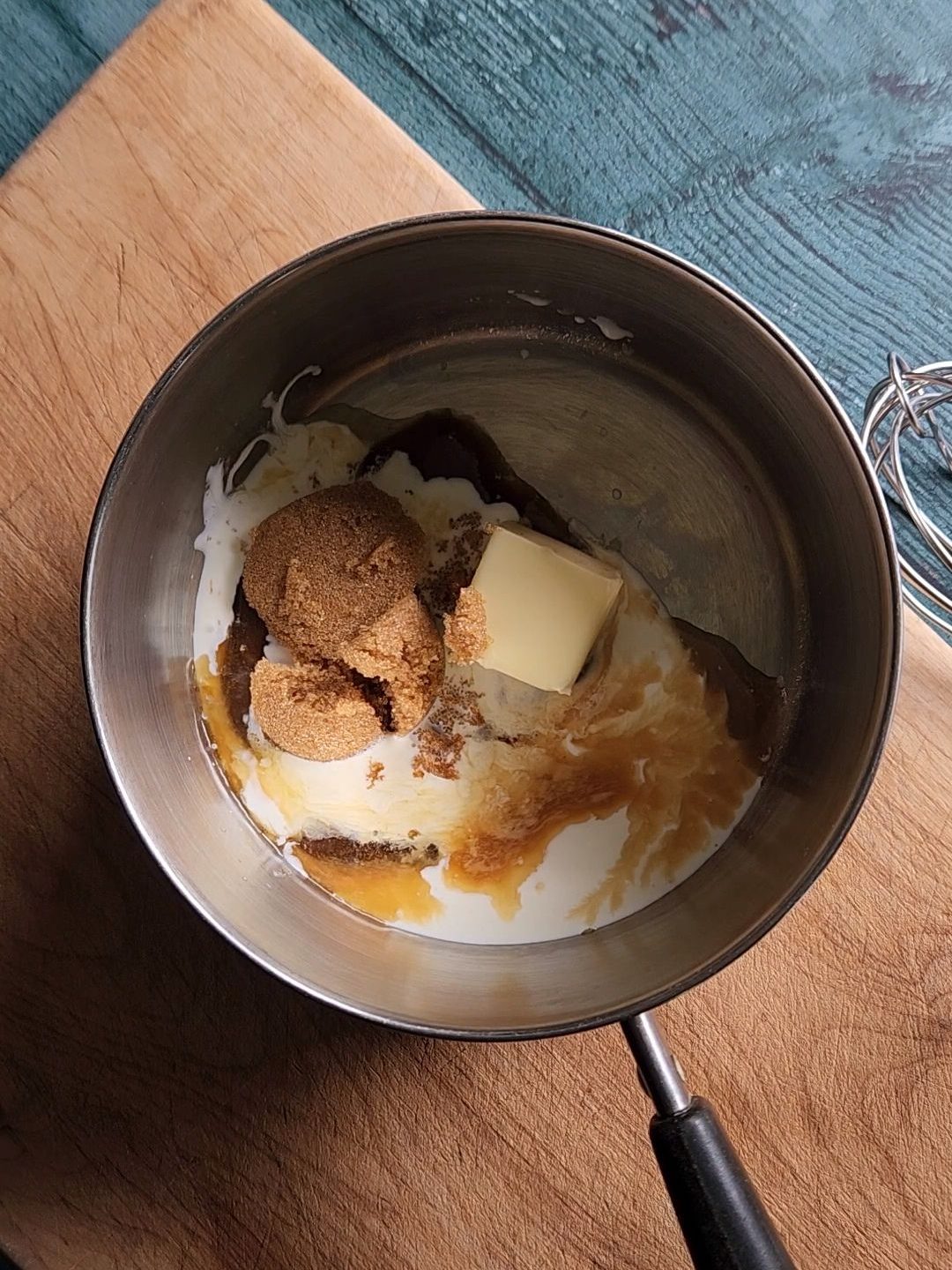 All ingredients in a saucepan to make keto maple glaze.