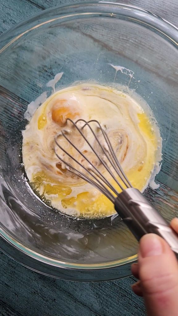 Whisking wet ingredients for gluten-free maple donuts.