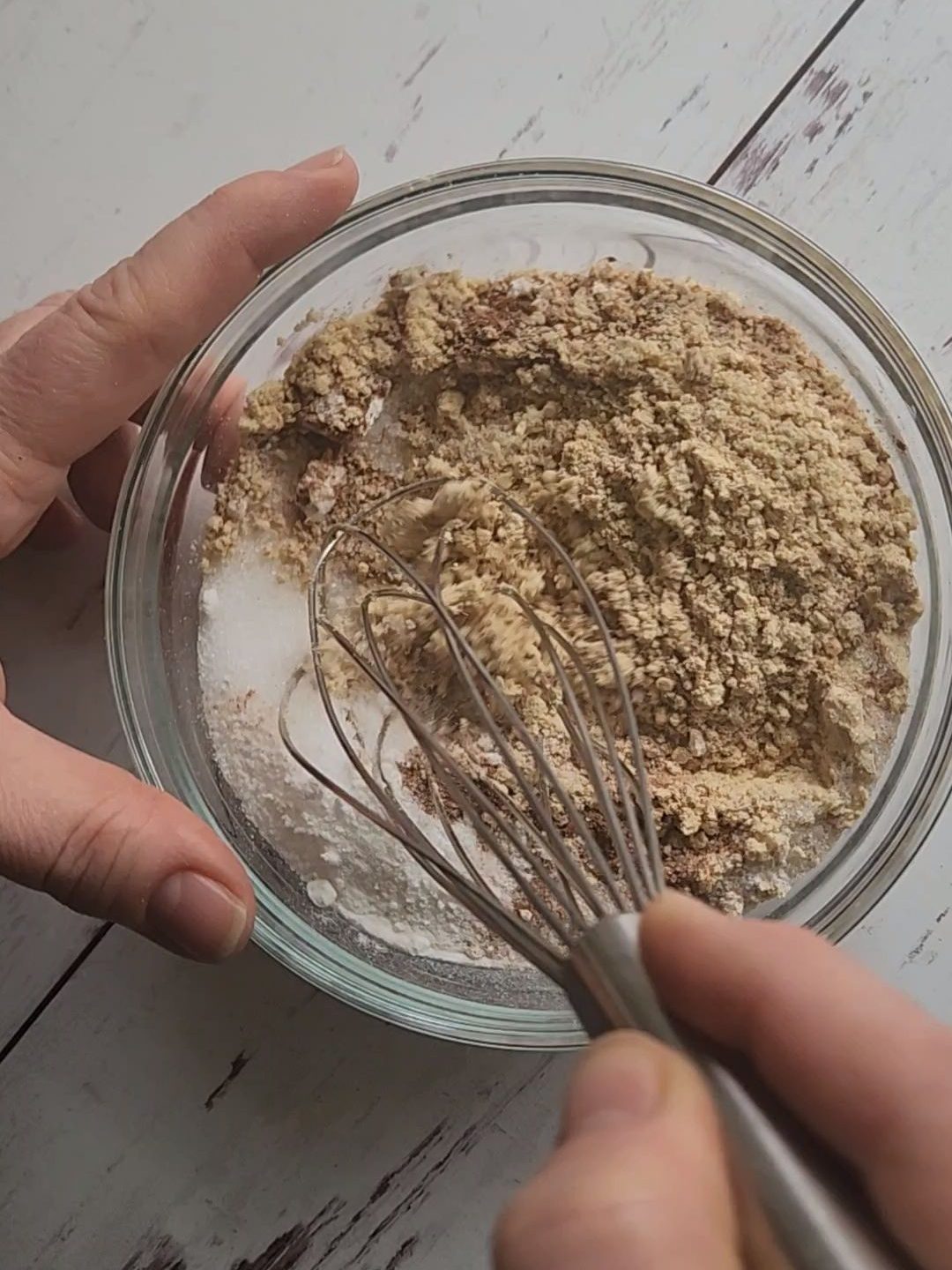 Whisking dry ingredients for easy gluten-free fluffy baked pecan pancake recipe.
