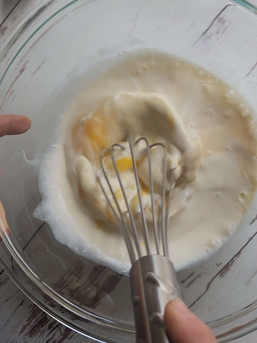 Whisking wet ingredients for easy gluten-free fluffy baked pecan pancake recipe.