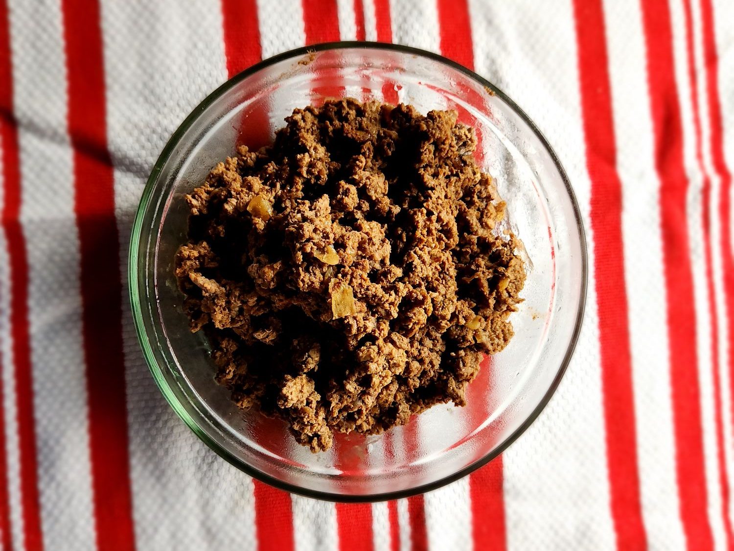 leftover taco meat in a glass bowl.