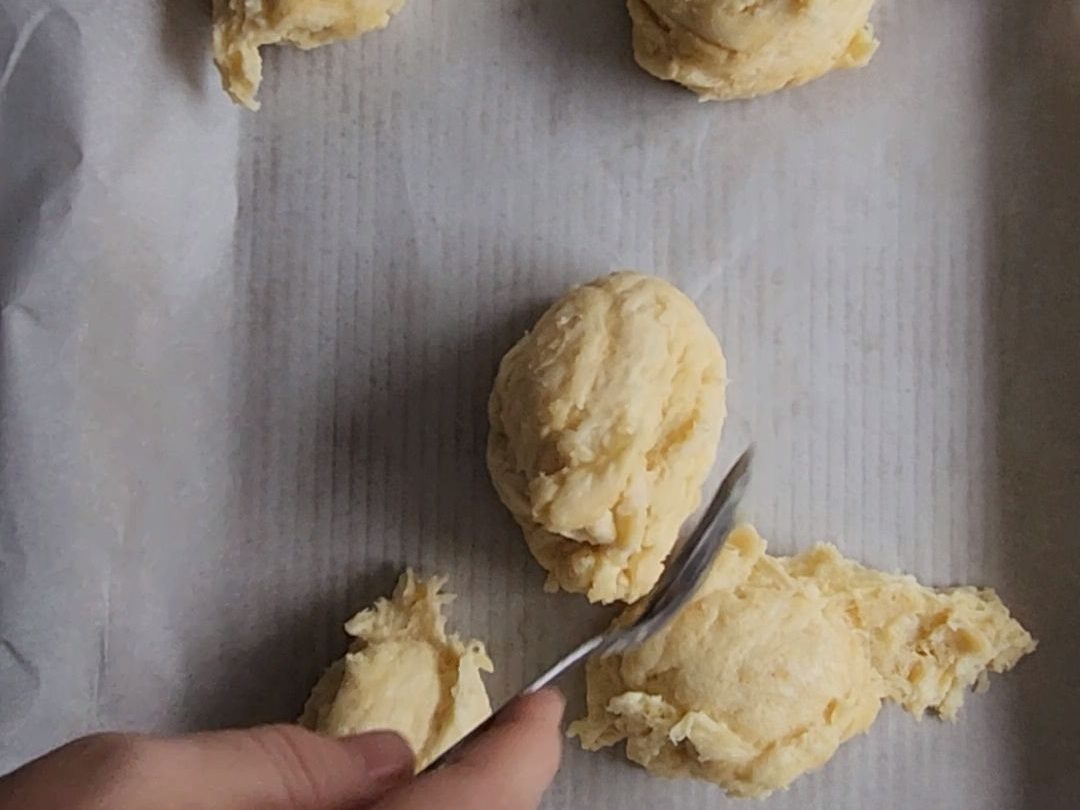 Pressing the crust out for the best gluten-free keto friendly pizza pressed out into a pan.