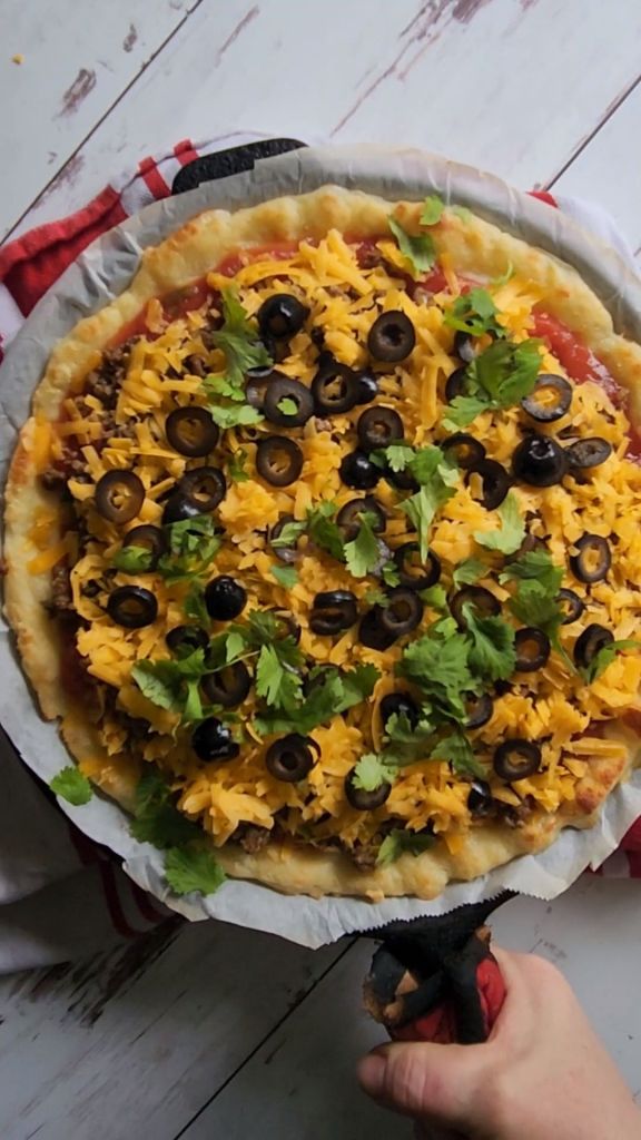 Assembled gluten-free copycat Godfather's taco pizza ready for the oven.