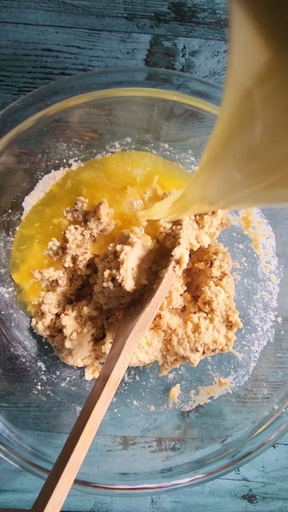 Stirring melted butter into scone dough.