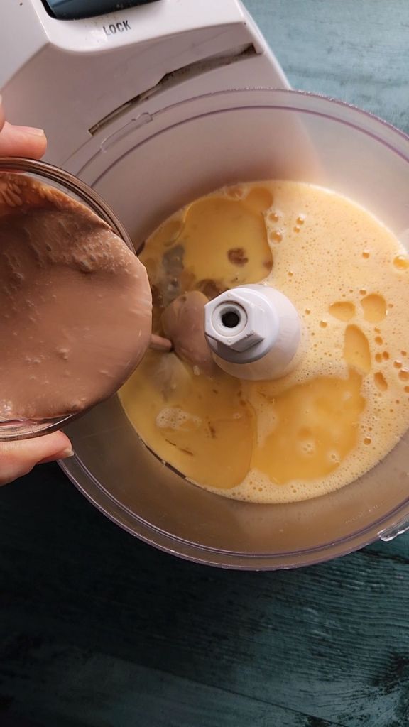 Blending wet ingredients for gluten-free Bailey's Irish cream chocolate bundt cake.