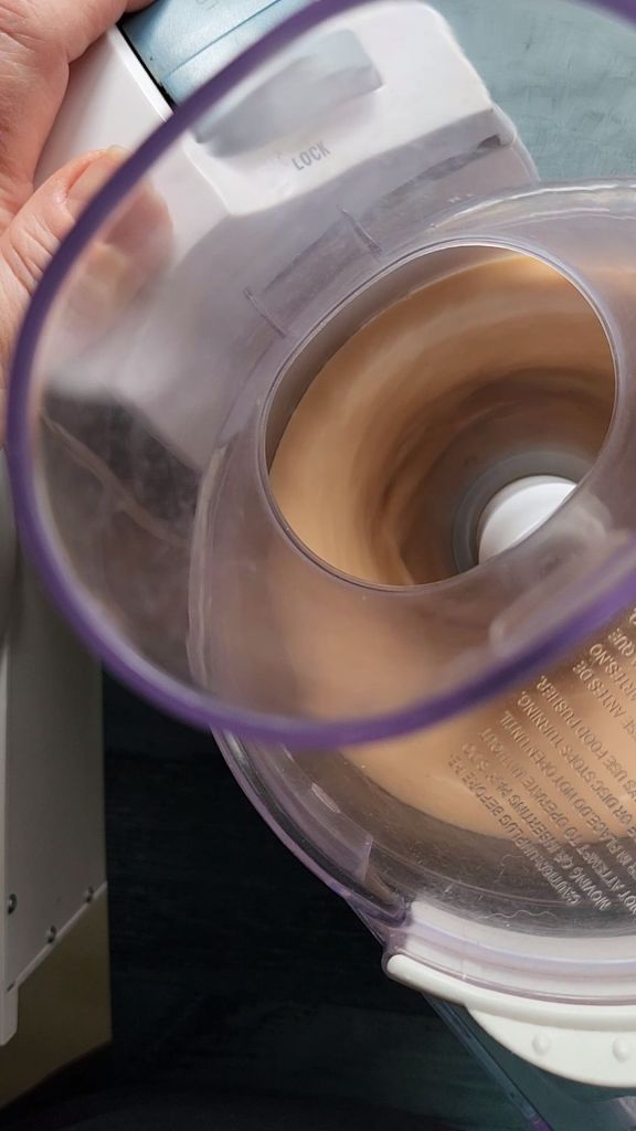 Blending wet ingredients for gluten-free Bailey's Irish cream chocolate bundt cake.