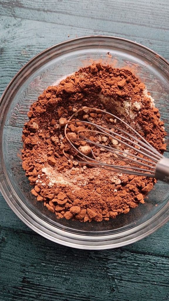 Whisking dry ingredients for gluten-free Baileys Irish Cream chocolate bundt cake.