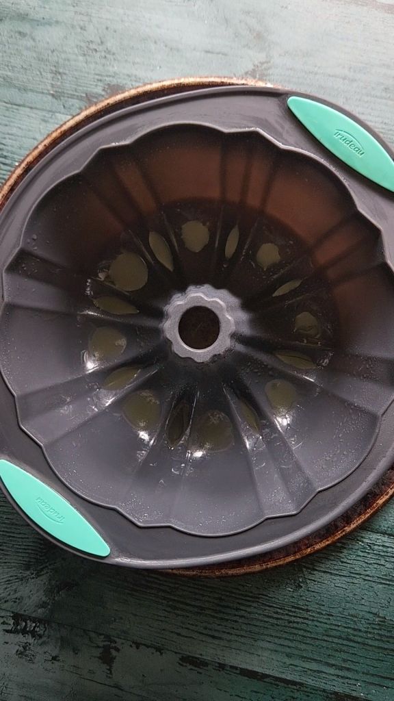 Silicone bundt pan greased for gluten-free Baileys Irish Cream chocolate bundt cake recipe.