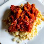Easy gluten-free copycat McCormick Swiss steak recipe plated on cauliflower rice.