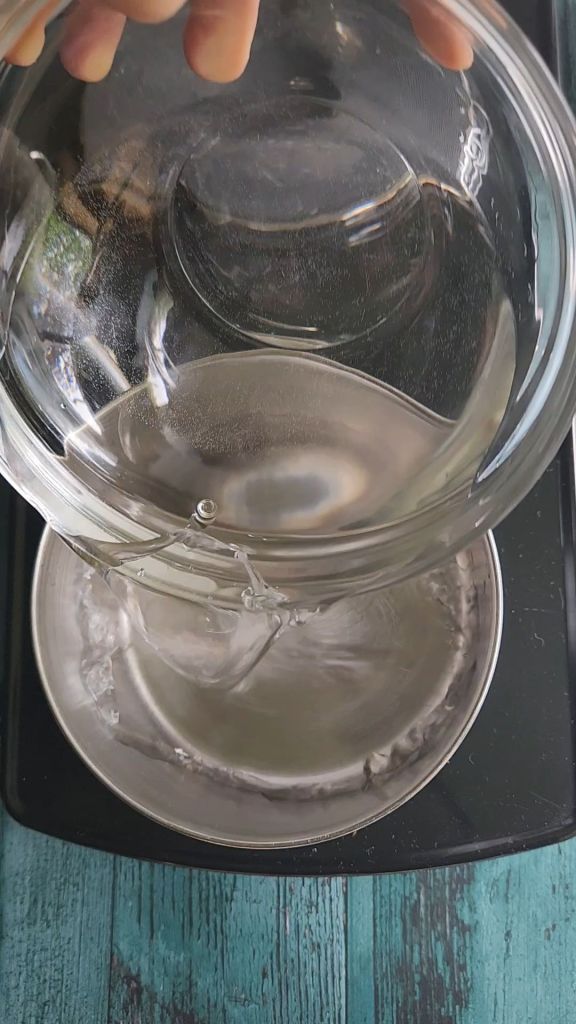 Adding water to sauce pan for easy low carb Starbucks Copycat vanilla syrup recipe.