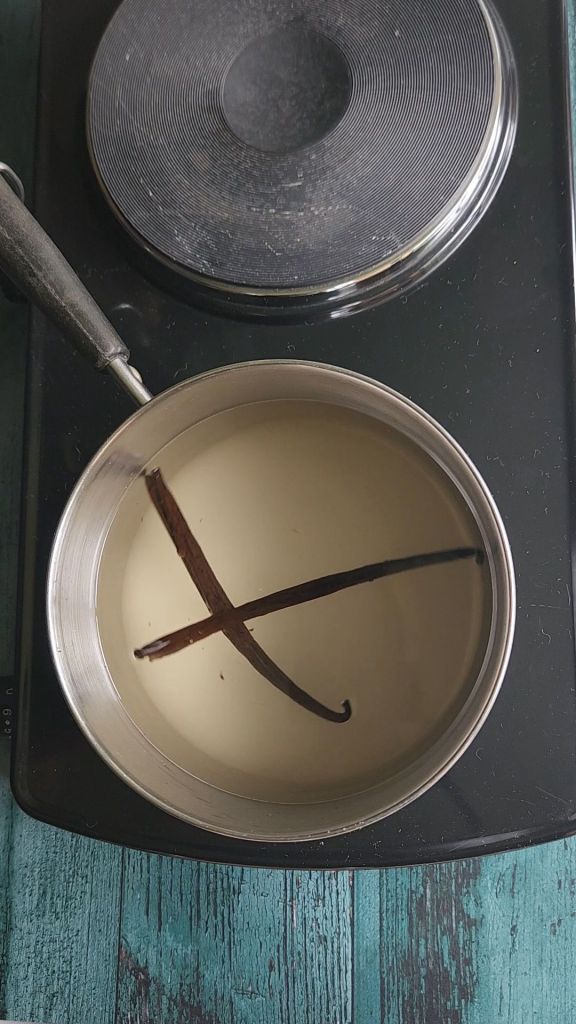 Stirring ingredients in saucepan for easy low carb Starbucks Copycat vanilla syrup recipe.