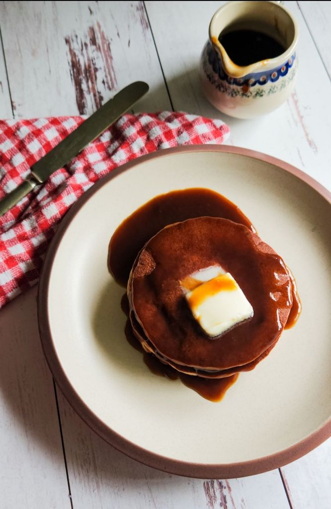 Easy gluten free blender pancakes recipe on a plate with butter and syrup.