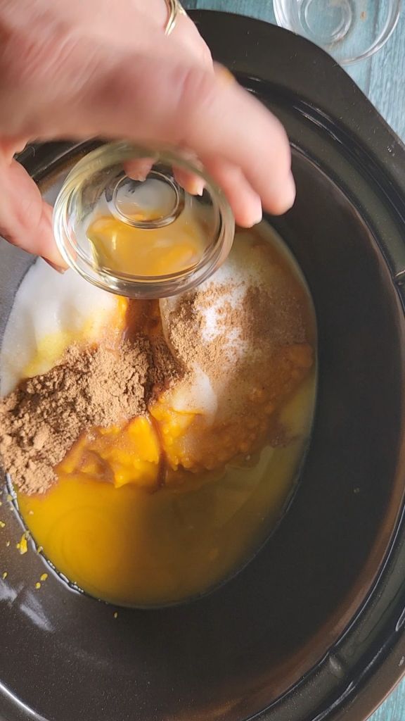 Adding vanilla extract to Easy crock pot sugar free pumpkin butter recipe keto.